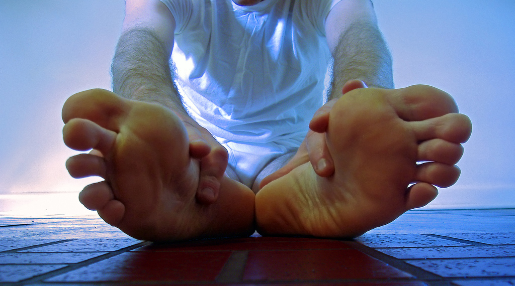 Plantar fasciitis typically causes a stabbing pain in the bottom of your foot near the heel. 